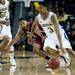 Michigan sophomore Trey Burke drives to the hoop against IUPUI defenders on Monday. Michigan leads at halftime 45-31. Daniel Brenner I AnnArbor.com